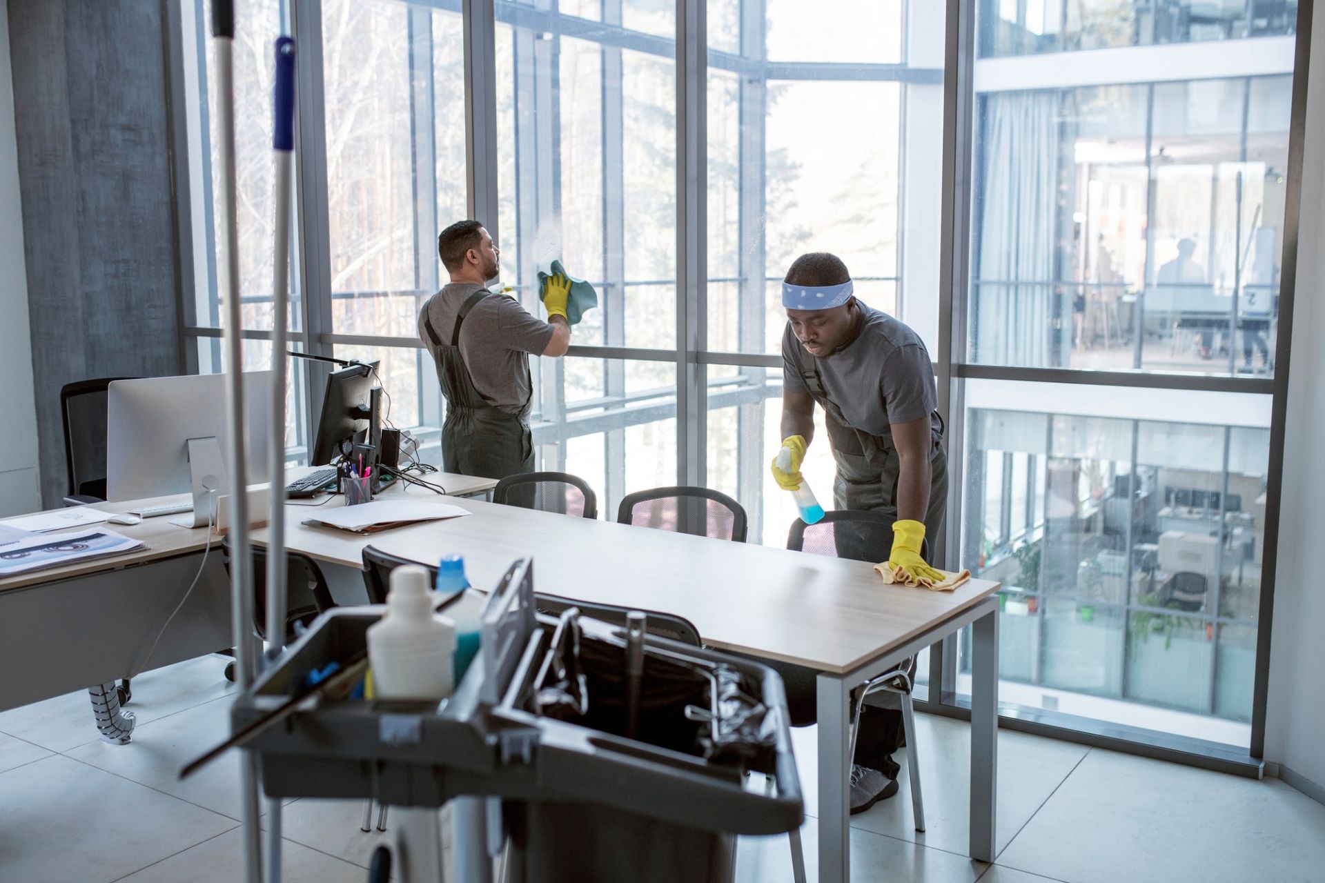 Full shot men cleaning office Full shot men cleaning office